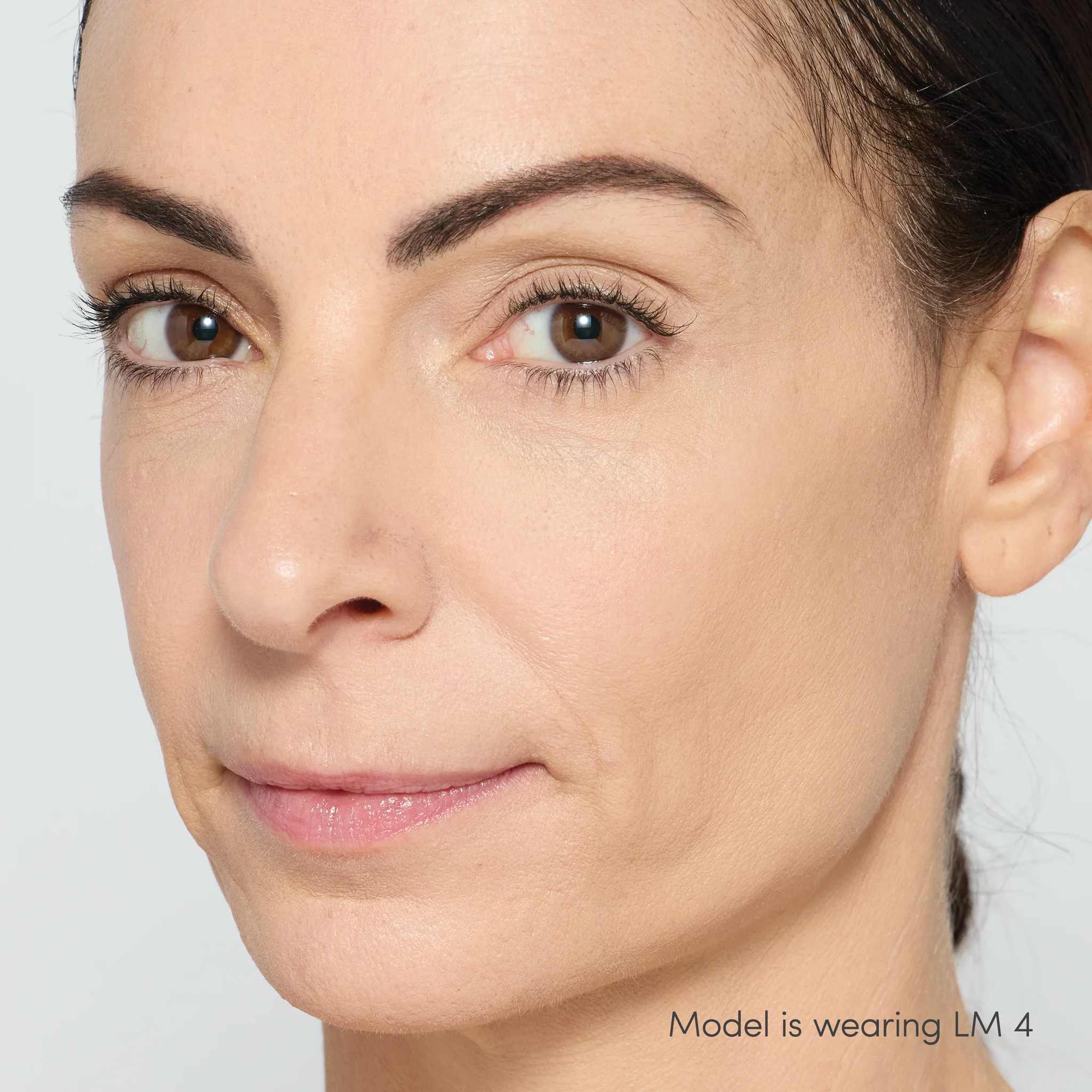 Jane Iredale Skintuition Liquid Concealer LM4 - light medium with neutral undertones worn on model with glowing skin 3 