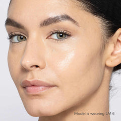 Jane Iredale Skintuition Liquid Concealer LM6 light medium with gold undertones worn on model with glowing skin 3