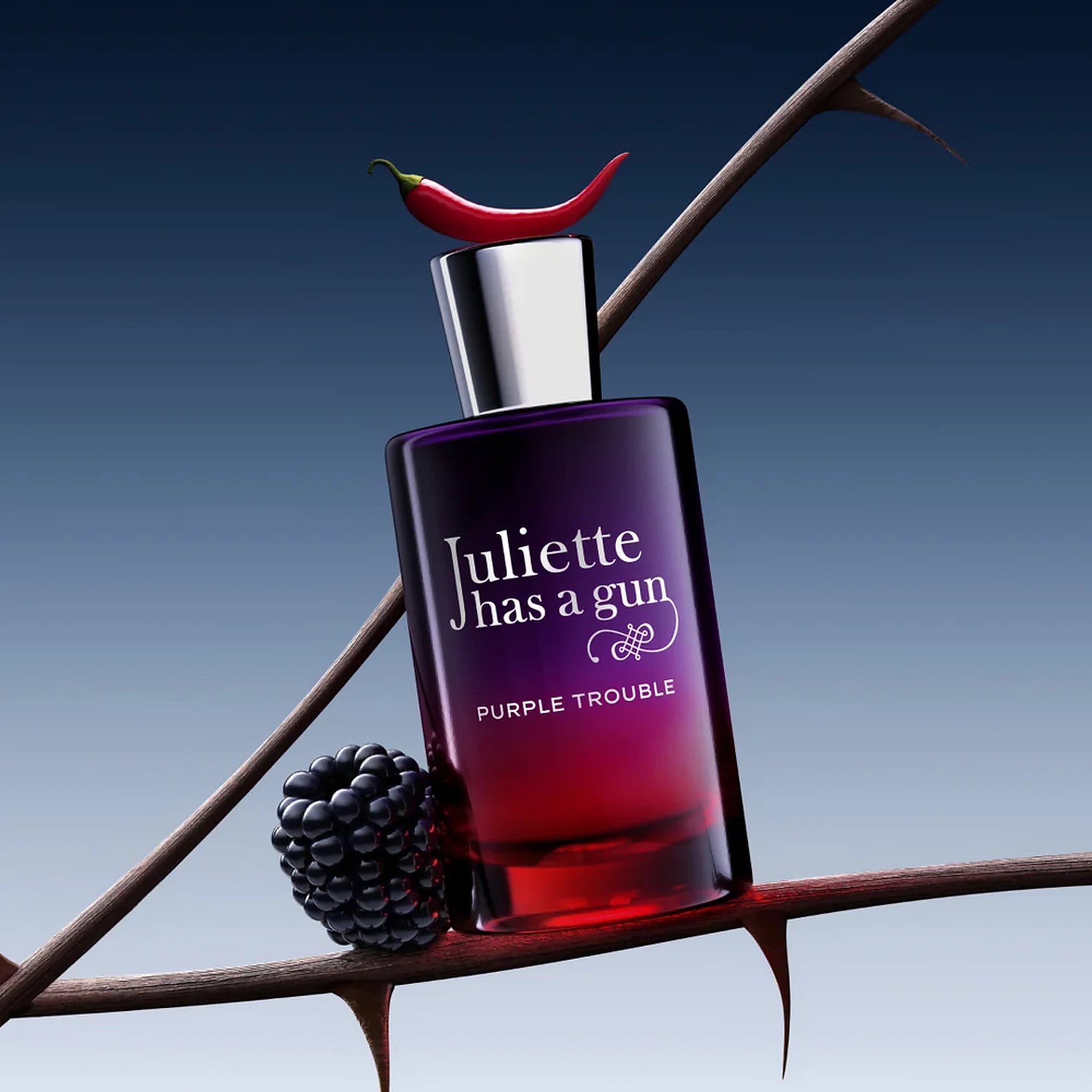 Juliette Has a Gun Purple Trouble perfume on a thorny branch with blackberry and chili notes