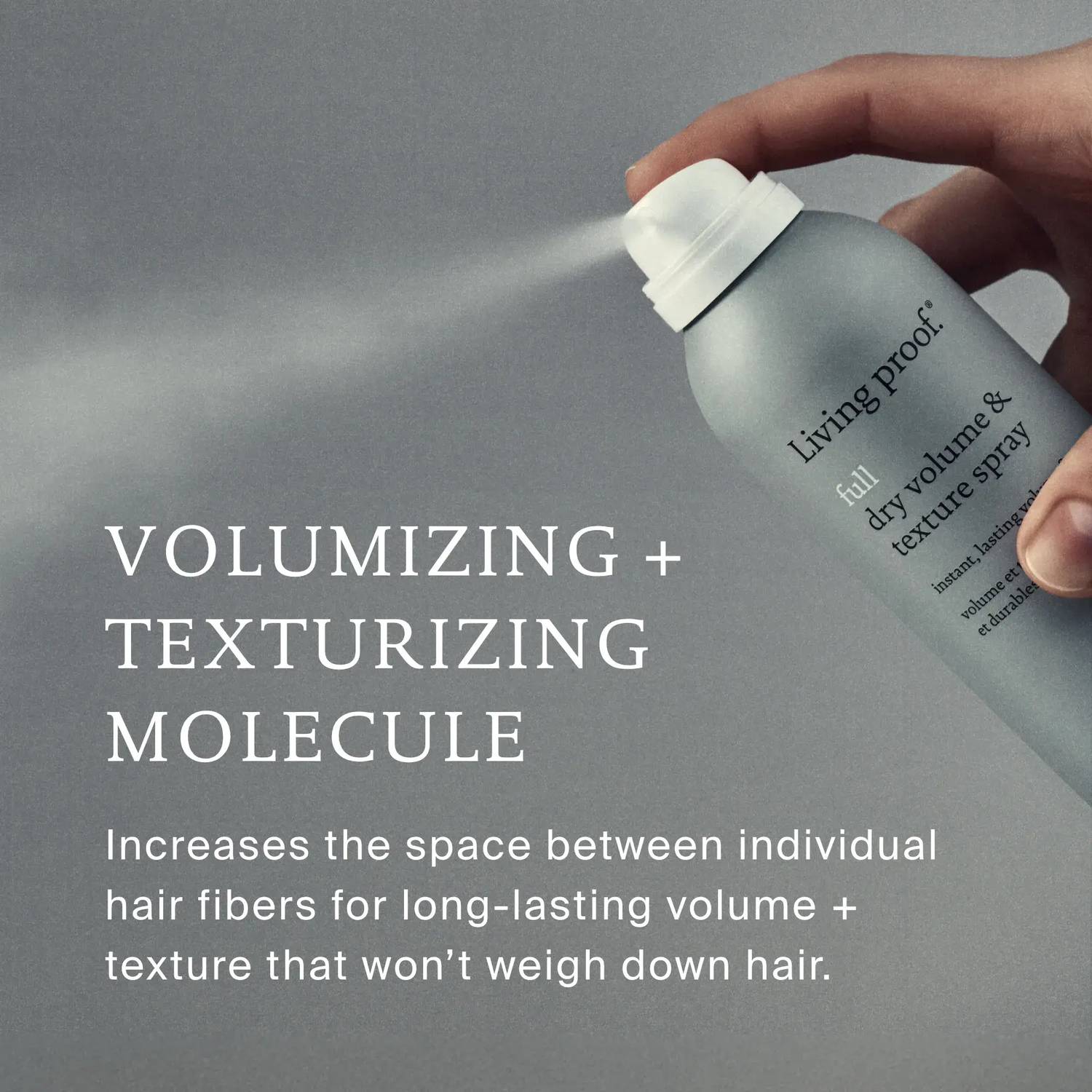 Hand spraying Living Proof Full Dry Volume and Texture Spray with volumizing texturizing molecule that won't weigh hair down