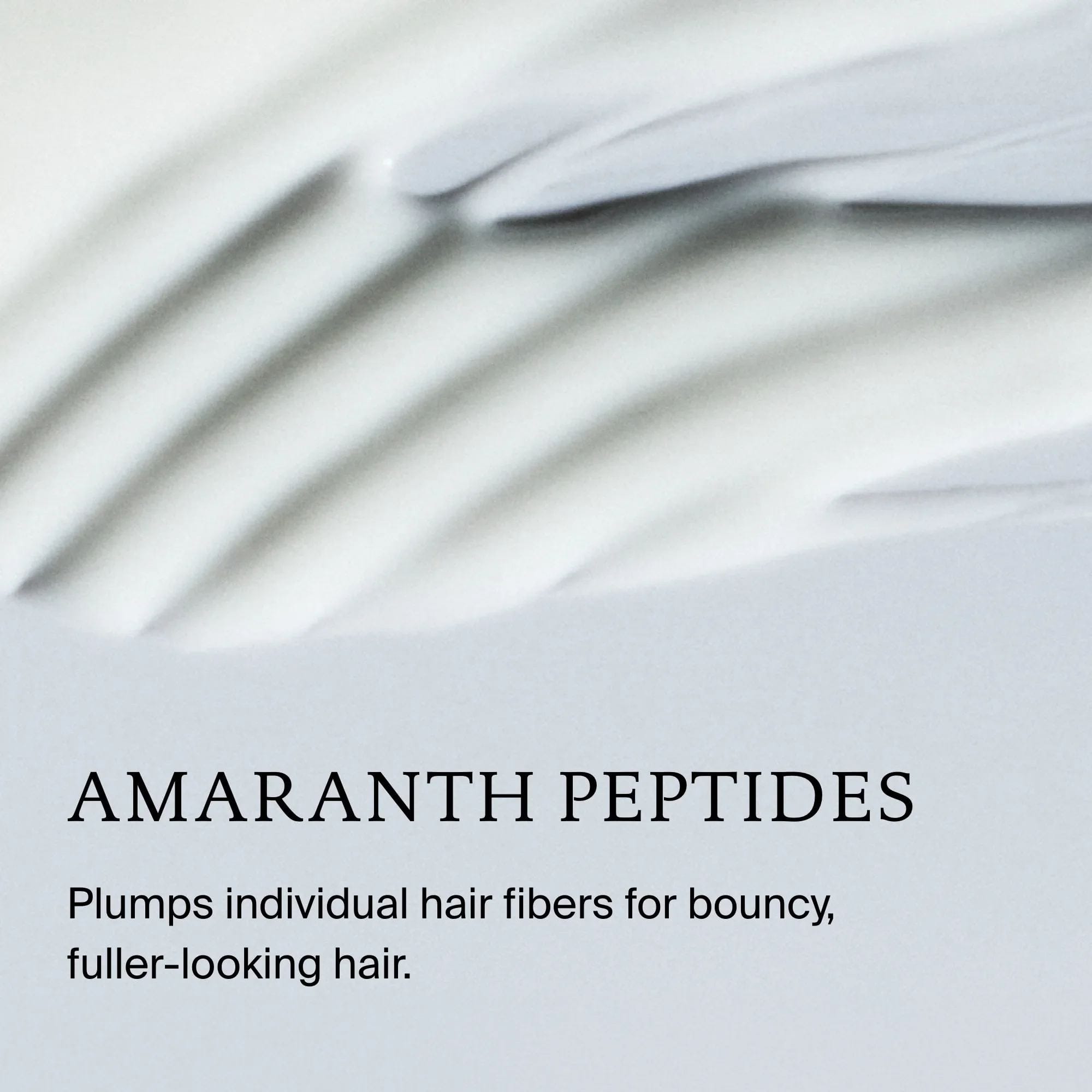 Living Proof Full Thickening Blow-Dry Cream texture with amaranth peptides that plump hair fibers for fuller hair