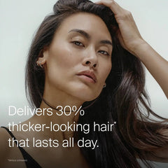 Woman with long dark hair showing Living Proof Full Thickening Blow-Dry Cream for 30 percent thicker-looking hair