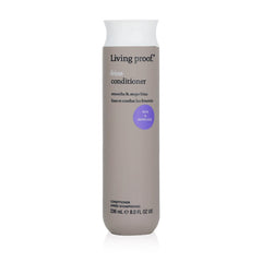 Living Proof No Frizz Conditioner 8 oz smoothing conditioner in round bottle with New and Improved badge on white