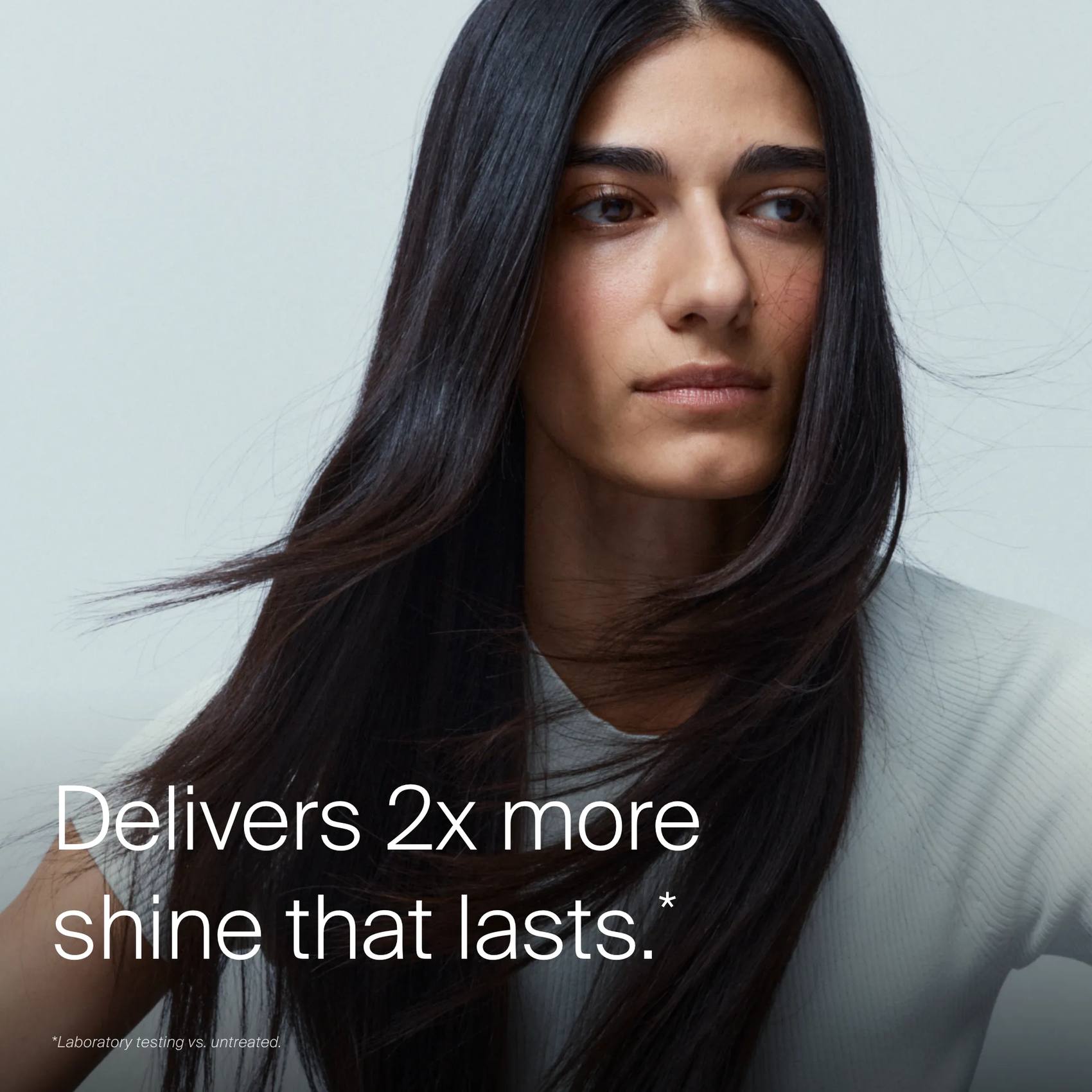 Woman with sleek glossy black hair showing Perfect hair Day High-Shine Gloss delivers 2x more shine that lasts