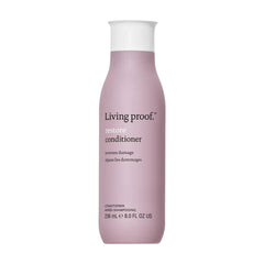 Living Proof Restore Conditioner 8 oz in rounded bottle that reverses damage for stronger smoother hair on white