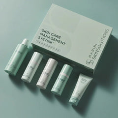 Marini Skin Solutions Skin Care Management System flatlay showing 5 products with box for normal/combination skin on teal background 5