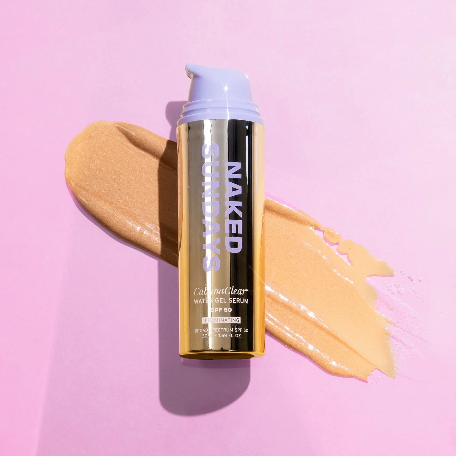Naked Sundays CabanaClear illuminating water gel serum SPF50 bottle resting on a golden shimmer swatch