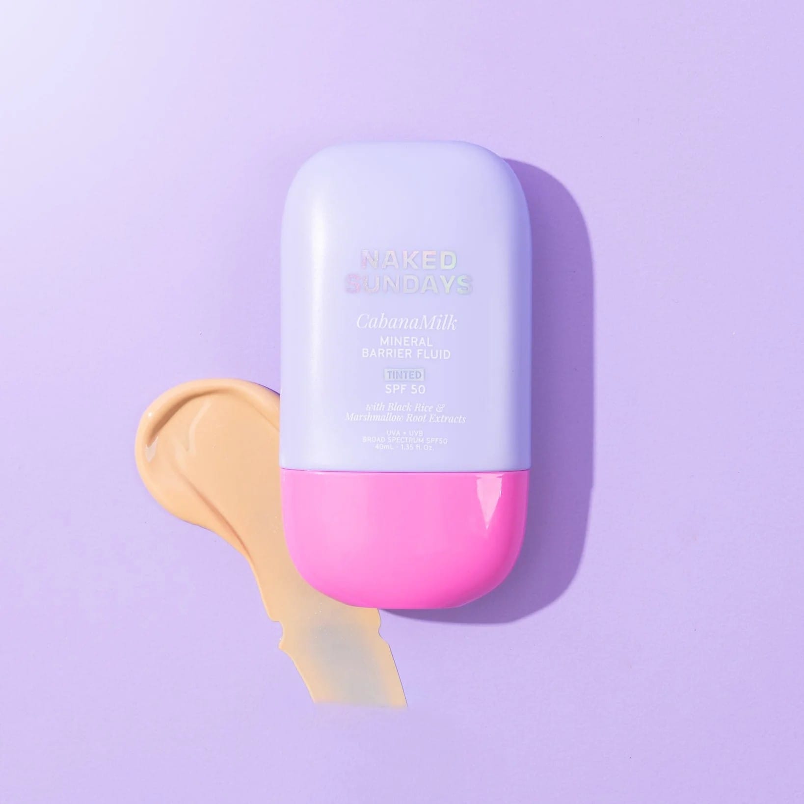 Naked Sundays CabanaMilk tinted SPF50 barrier fluid bottle with a tinted lotion swatch on purple