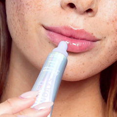 Naked Sundays PoutScreen SPF50 lip treatment being applied directly to the lips 2