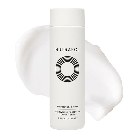 Nutrafol Strand Defender lightweight protective conditioner bottle with cream texture swirl