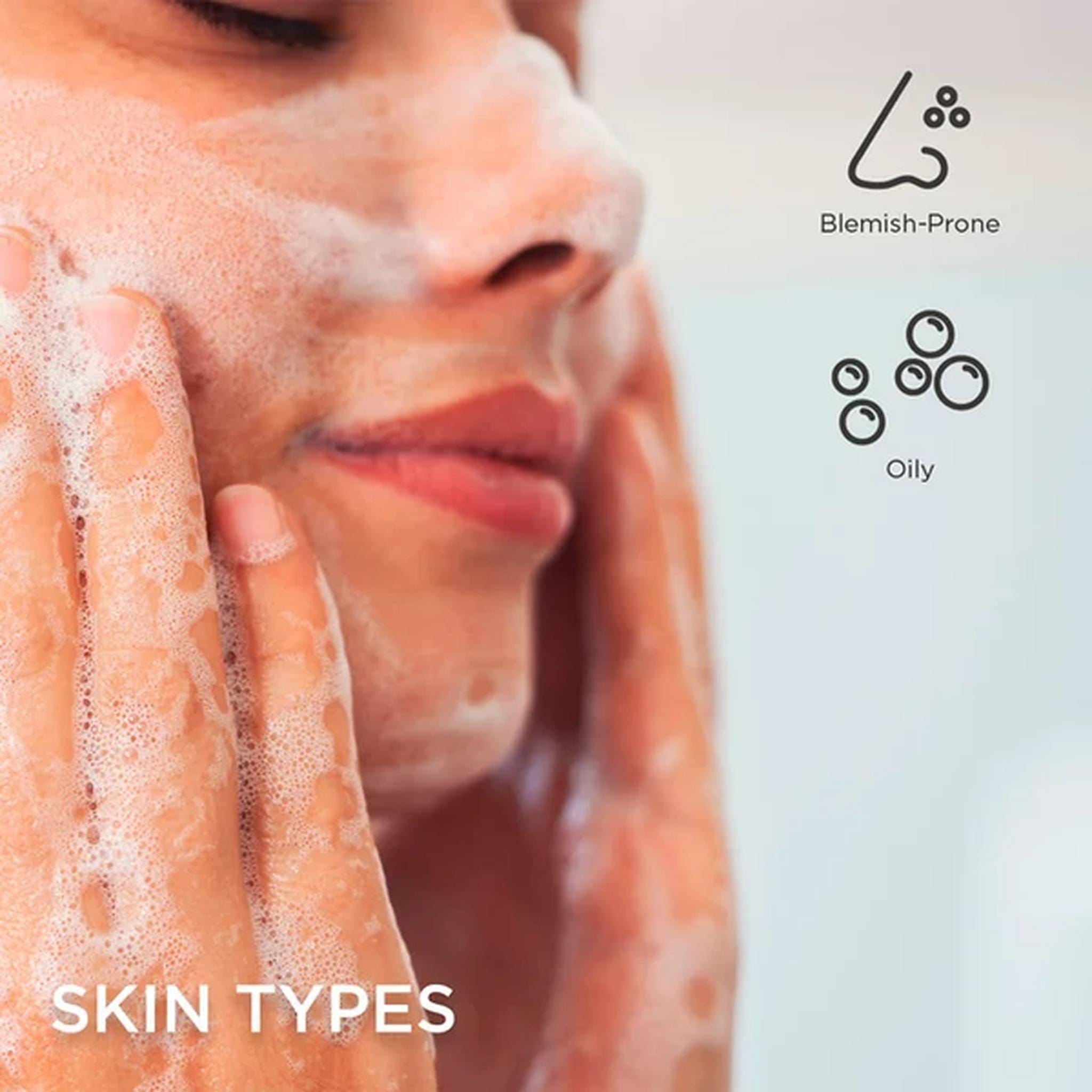 Woman washing face with Osmosis Deep Clean foaming cleanser for oily and blemish-prone skin