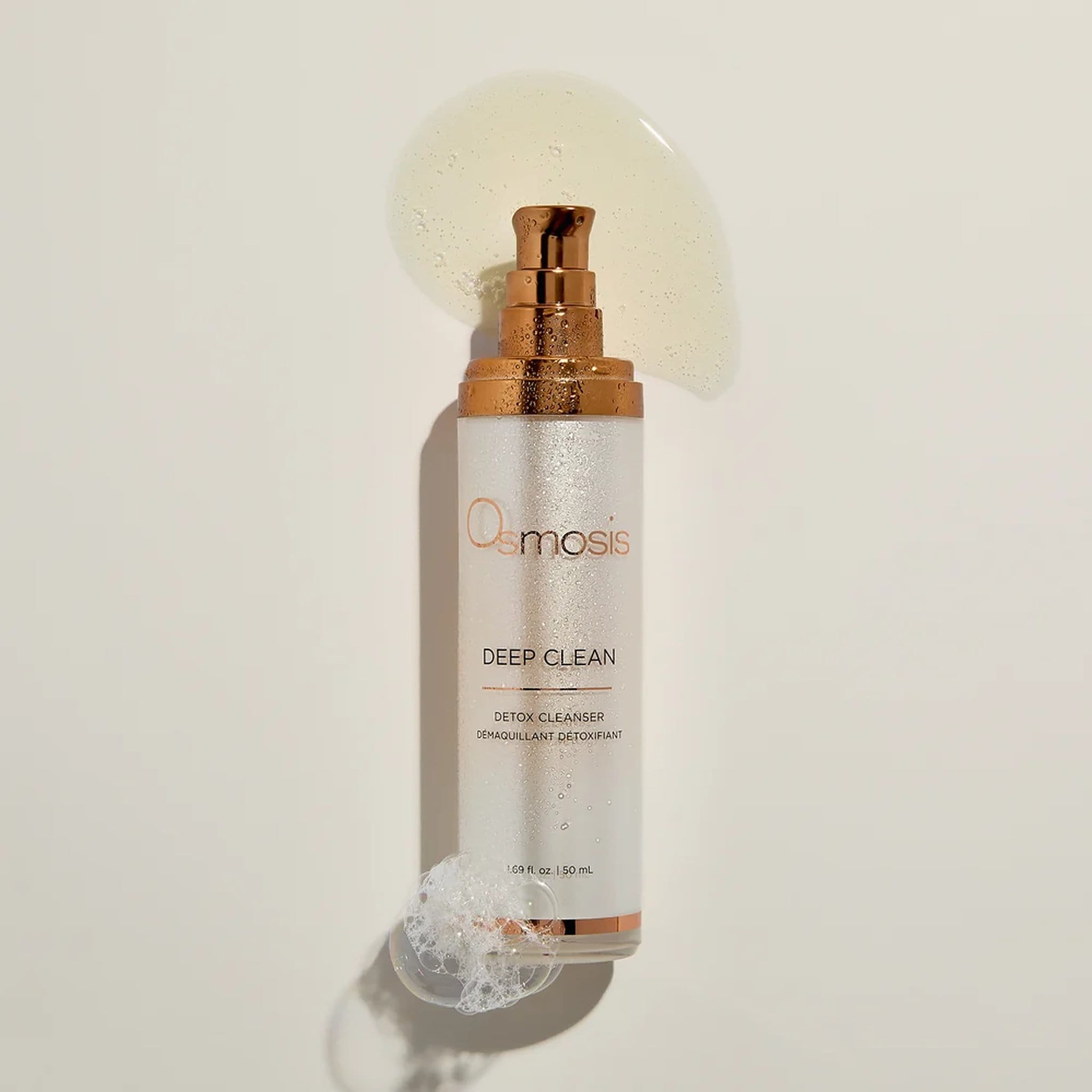 Osmosis Deep Clean Detox Cleanser bottle with clear gel texture swatch and foam lather