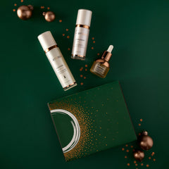 Osmosis Let It Glow Kit with Cleanse Replenish and Nourish on a green background with gold ornaments