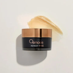 Osmosis Remedy MD jar beside rich golden healing balm texture swatch