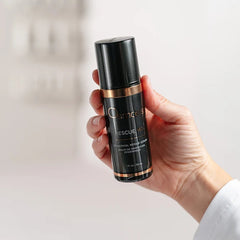 Hand holding Osmosis Rescue MD epidermal repair serum bottle in a bright clinical setting