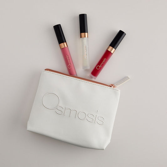 Osmosis Under the Mistletoe Lip Kit with three lip glosses and cosmetic bag on a white background