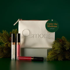 Osmosis Under the Mistletoe Lip Kit on a pedestal with an Under the Mistletoe gift tag