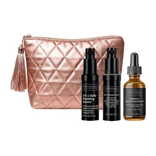 Revision Skincare Glowing Serum Soirée gift set with DEJ Daily Boosting Serum HA HydraSerum+ and Radiance+ serum in rose gold bag