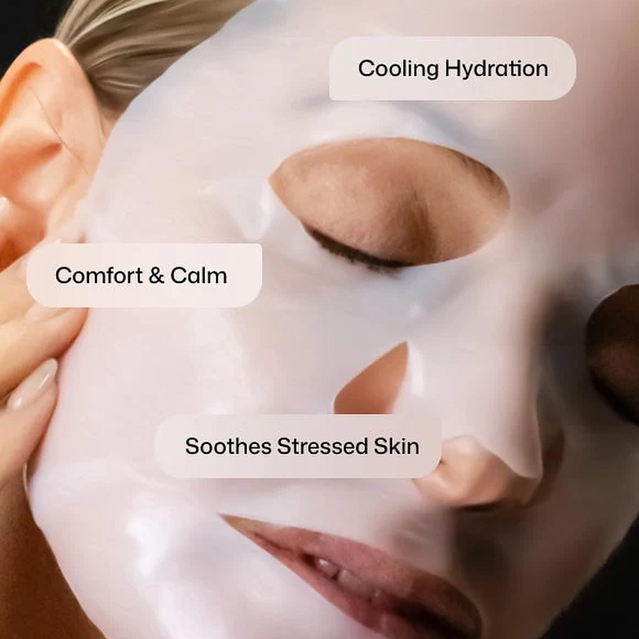 Woman wearing Revision Skincare Hydrating Biocellulose Mask for cooling hydration that soothes stressed skin (108)