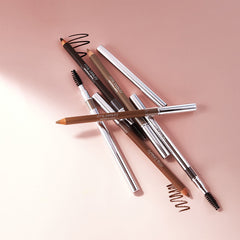 RMS Beauty Back2Brow Pencils and swatches styled together on a pink background 5