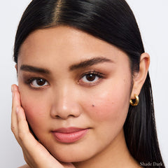 Model wearing RMS Beauty Back2Brow Pencil in shade Dark 7