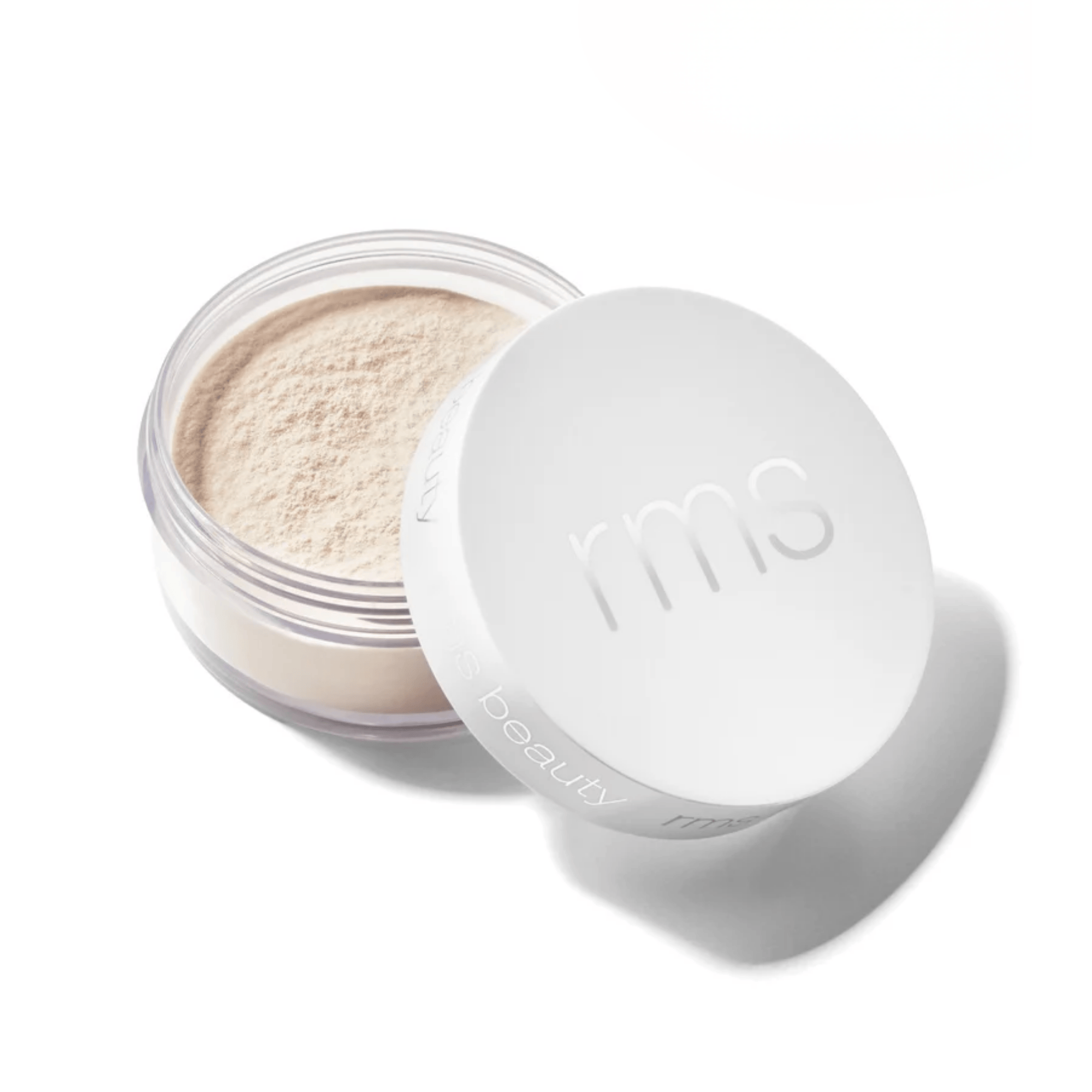 RMS Beauty loose setting powder in Light shade with lid open beside jar 1