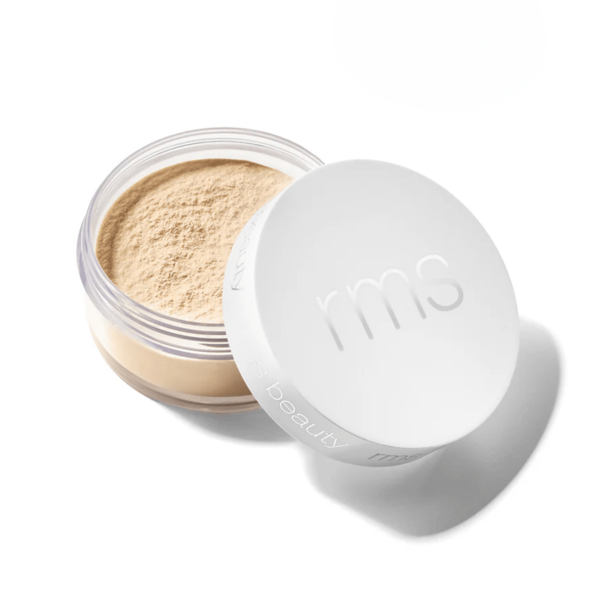 RMS Beauty loose setting powder in Medium shade with lid open beside jar 1