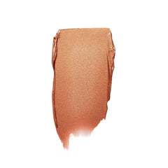 Shimmery bronze cream bronzer swatch showing texture and pigment