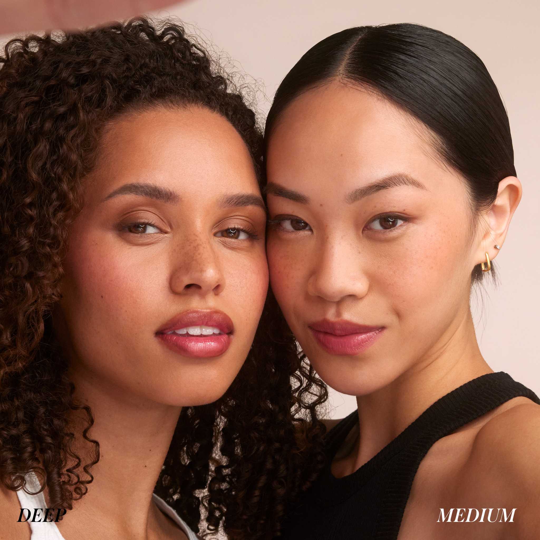 Two models wearing RMS Beauty Hydra Setting Powder in medium and deep shades 10