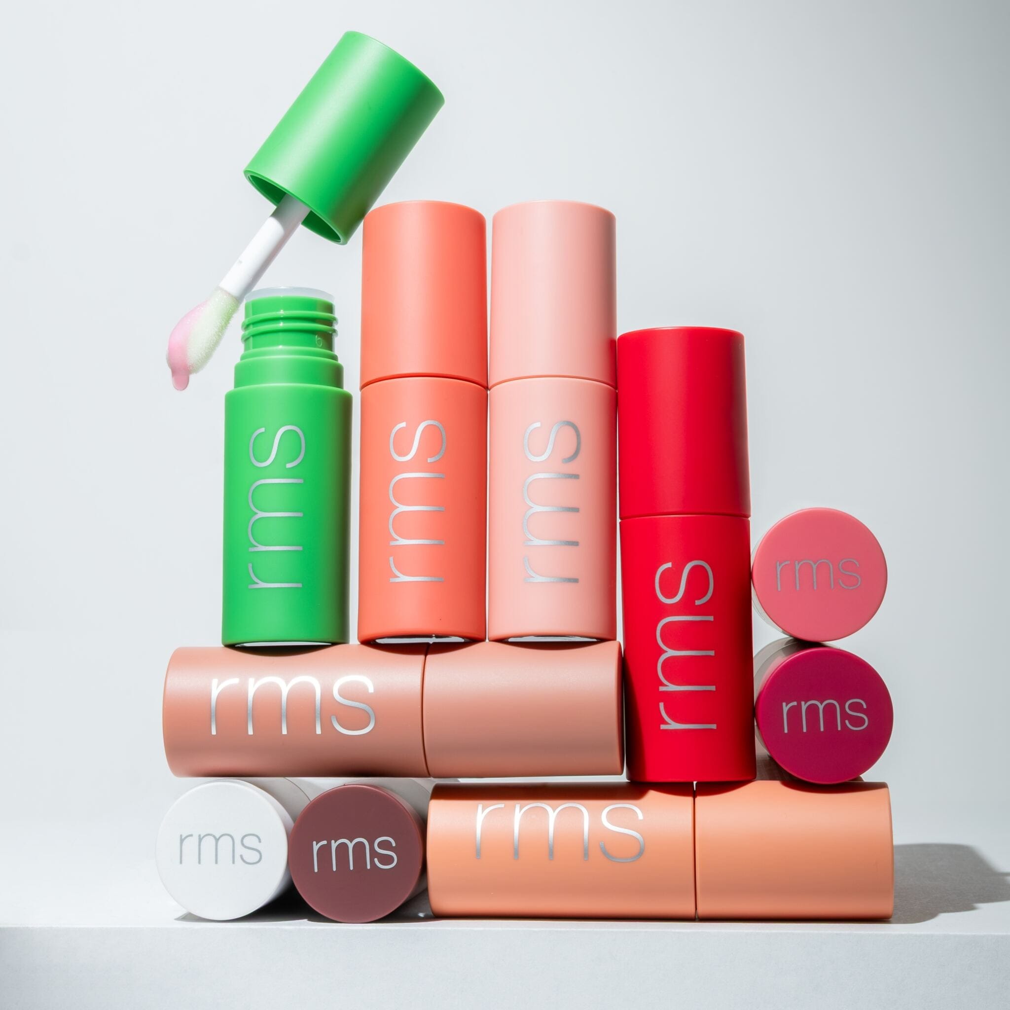 rms beauty lip oil collection styled in a stacked color arrangement 9