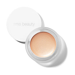 RMS Beauty Luminizer in Magic a warm champagne cream highlighter in an open jar 1