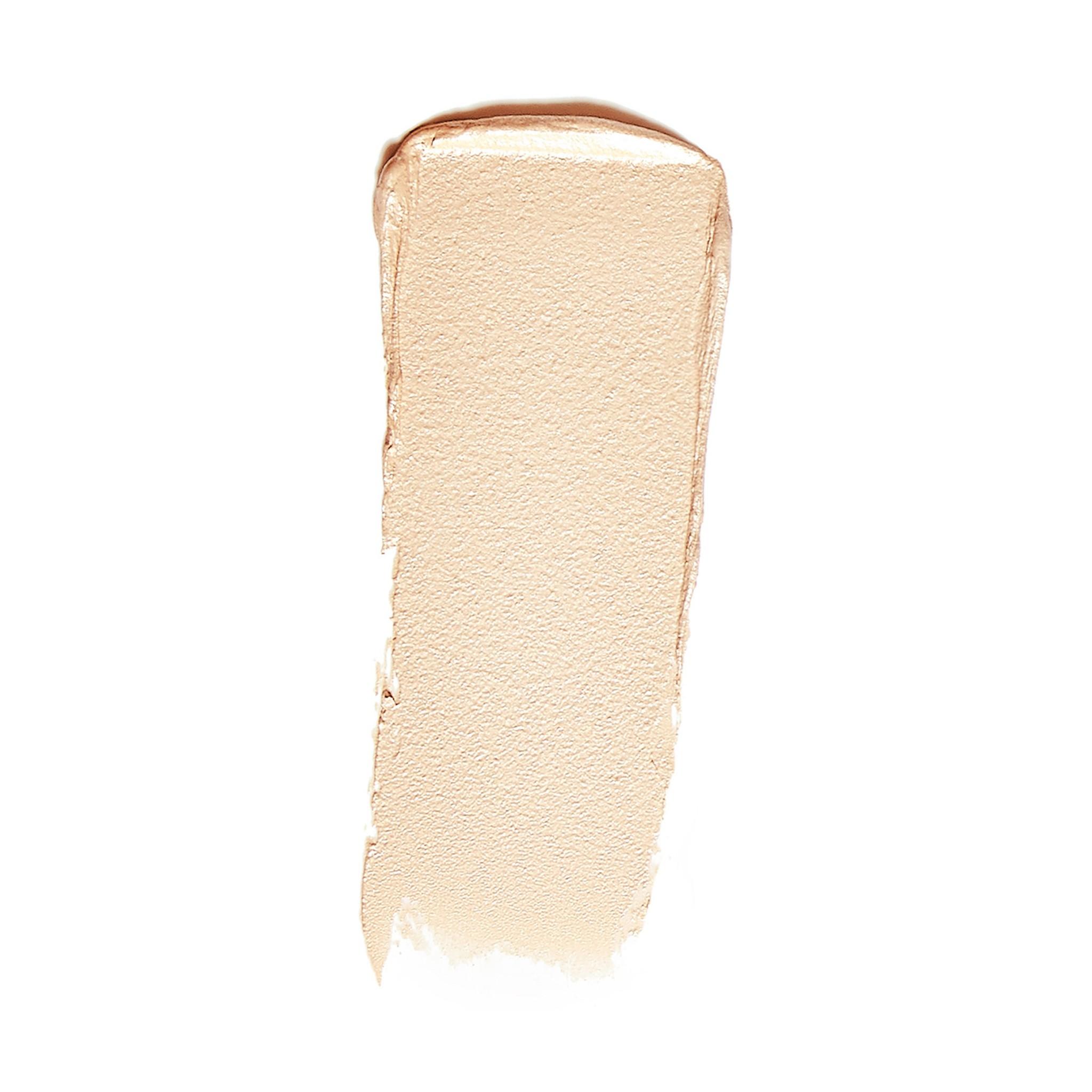 RMS Beauty Luminizer Magic swatch showing a warm champagne cream highlighter 2