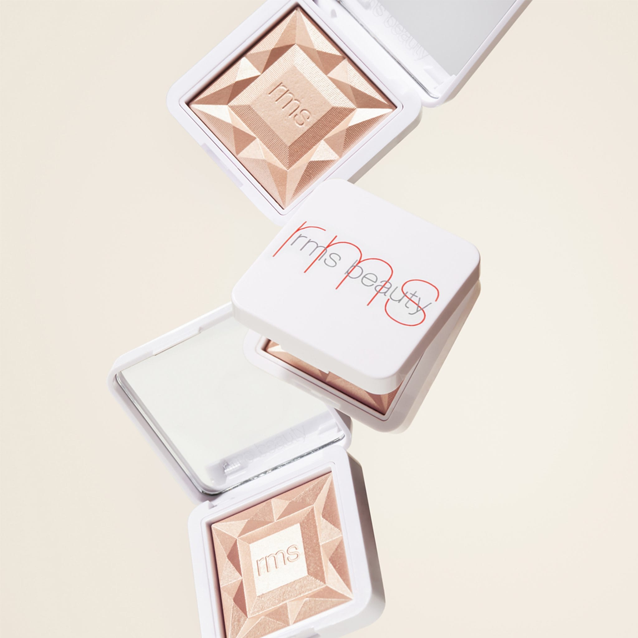 RMS Beauty ReDimension Hydra Dew highlighter compacts styled together 4