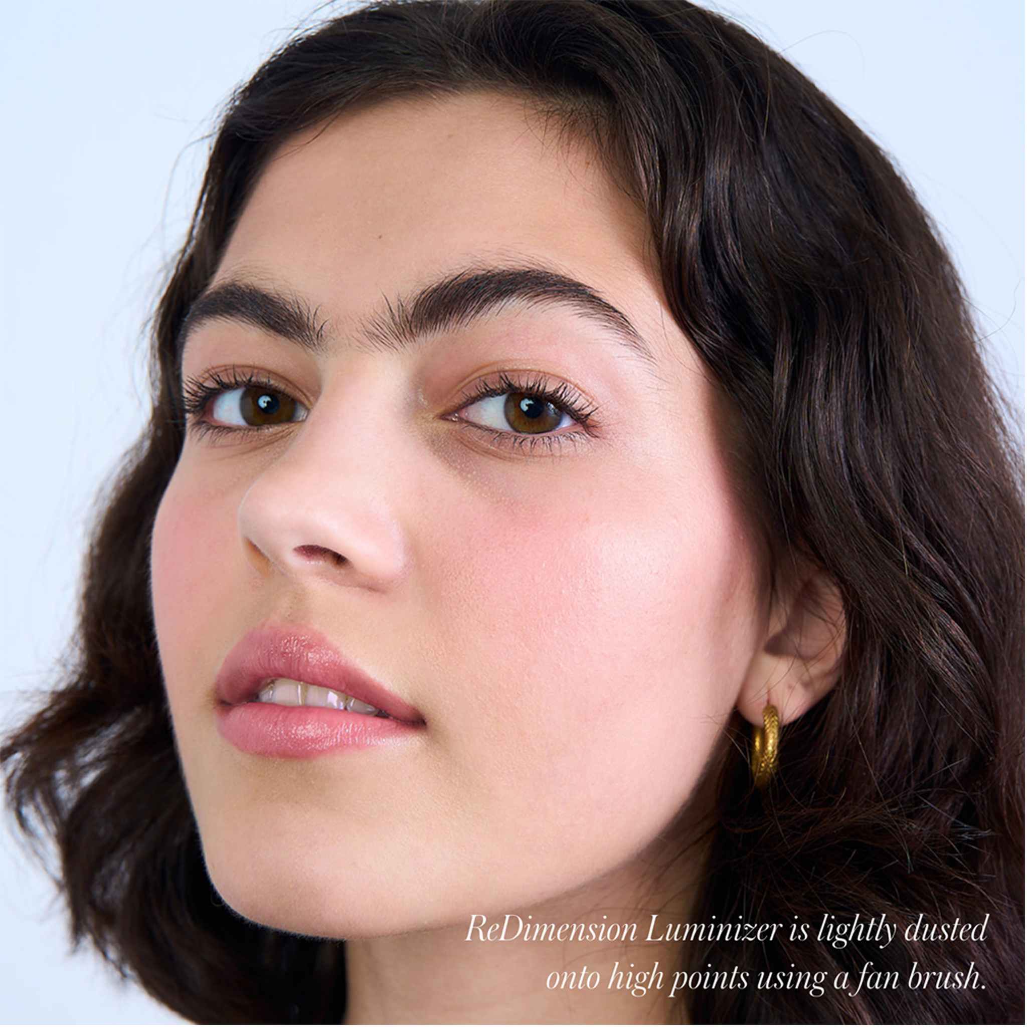 Model with dewy cheekbone highlight from RMS Beauty ReDimension Hydra Dew 6