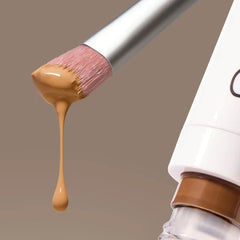 Skin2Skin Concealer Brush dipped in cream foundation beside product tube