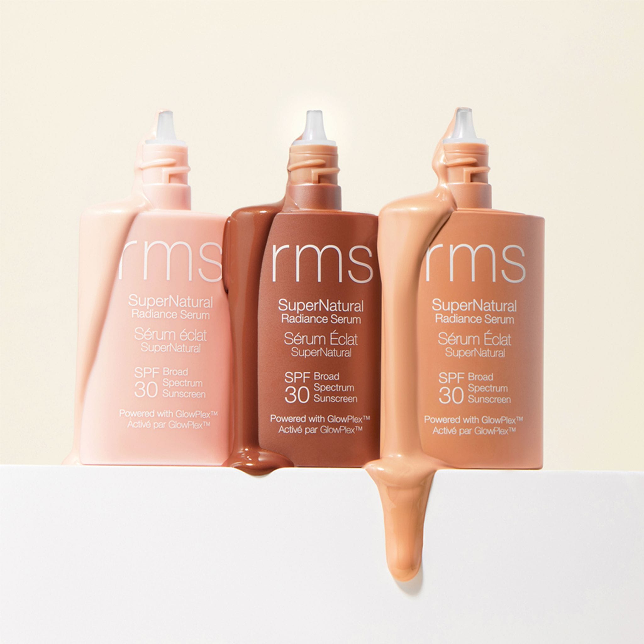 RMS Beauty SuperNatural Radiance Serum three shade bottles with dripping serum 8