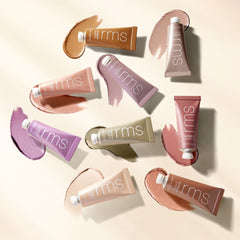 RMS Beauty Eyelights tubes and swatches styled together on a warm background 6