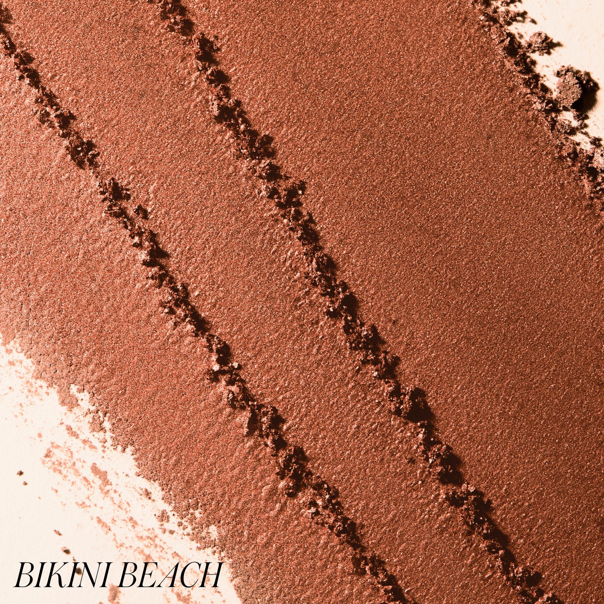Macro texture of ReDimension Hydra Bronzer powder in shade Bikini Beach 2