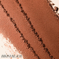 Macro texture of ReDimension Hydra Bronzer powder in shade Bikini Beach 2