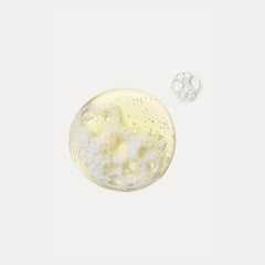 Senté Exfoliating Cleanser gel texture and lather closeup showing lightweight foaming formula