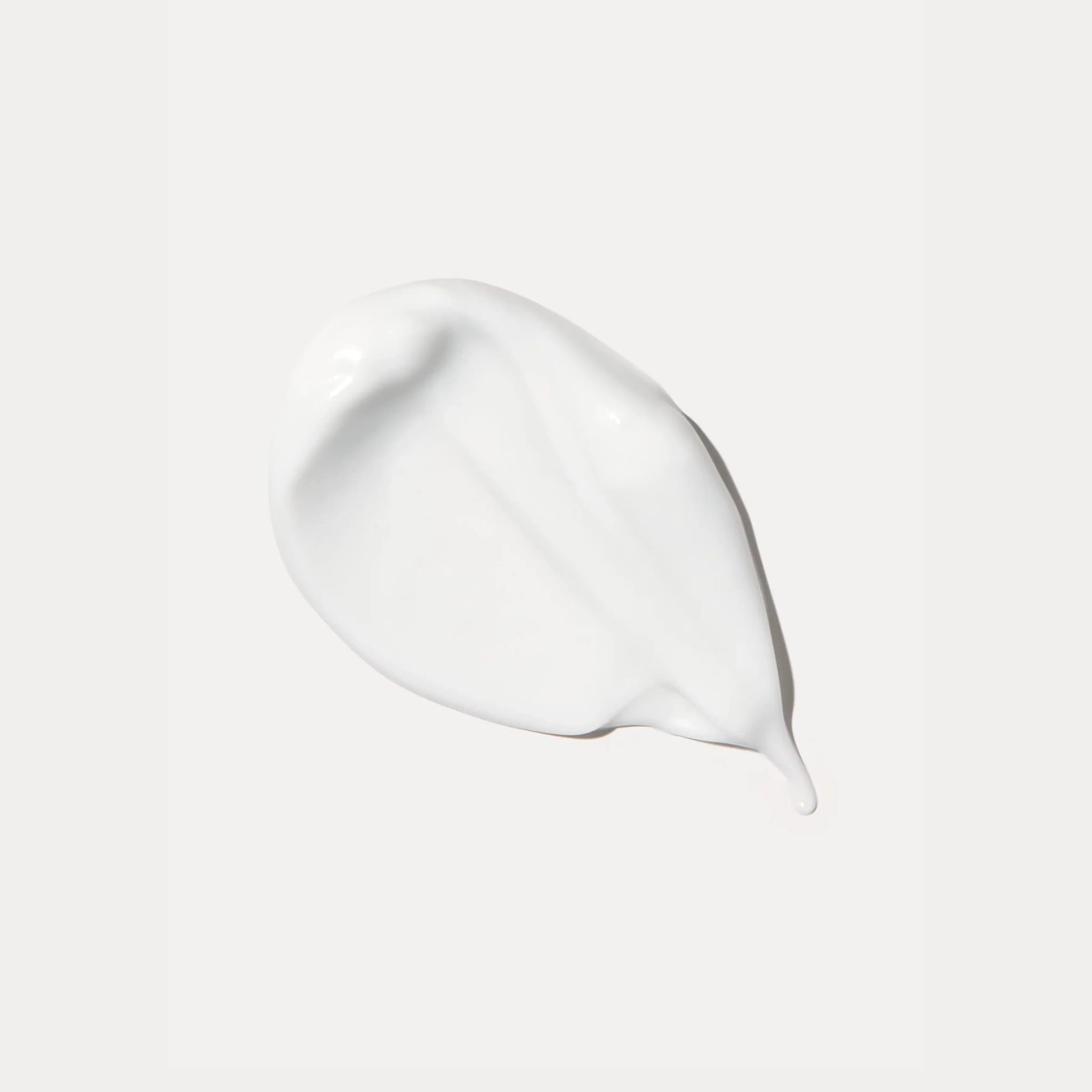 Senté Illuminé Eye Cream smooth rich cream texture closeup showing lightweight hydrating formula