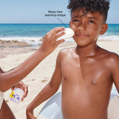 Mess free teardrop shaped sunscreen stick applied at the beach
