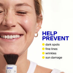 Applying Supergoop Resetting Mineral Powder SPF 35 to help prevent dark spots fine lines and wrinkles