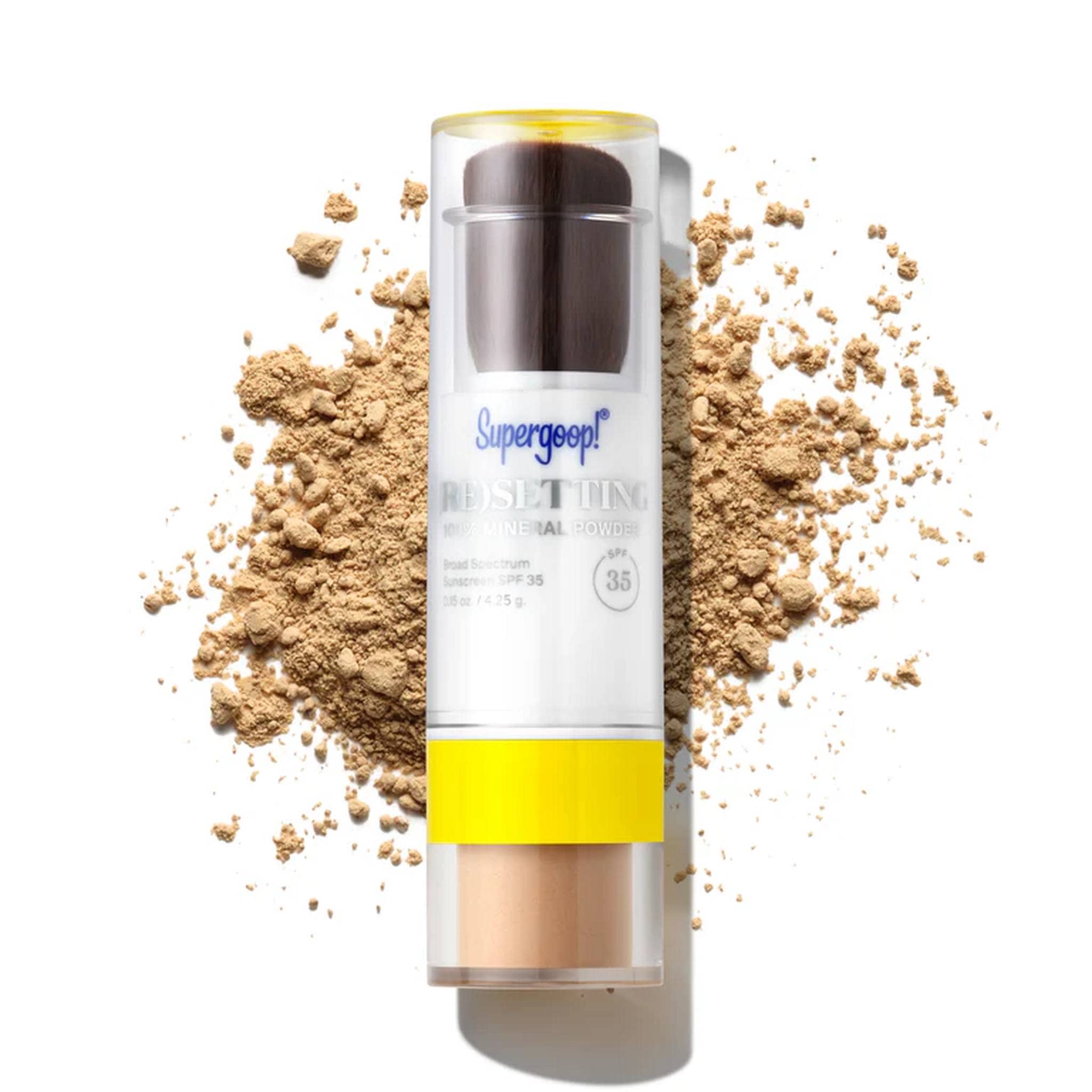 Supergoop Resetting 100% Mineral Powder SPF 35 stick in shade medium on scattered mineral powder