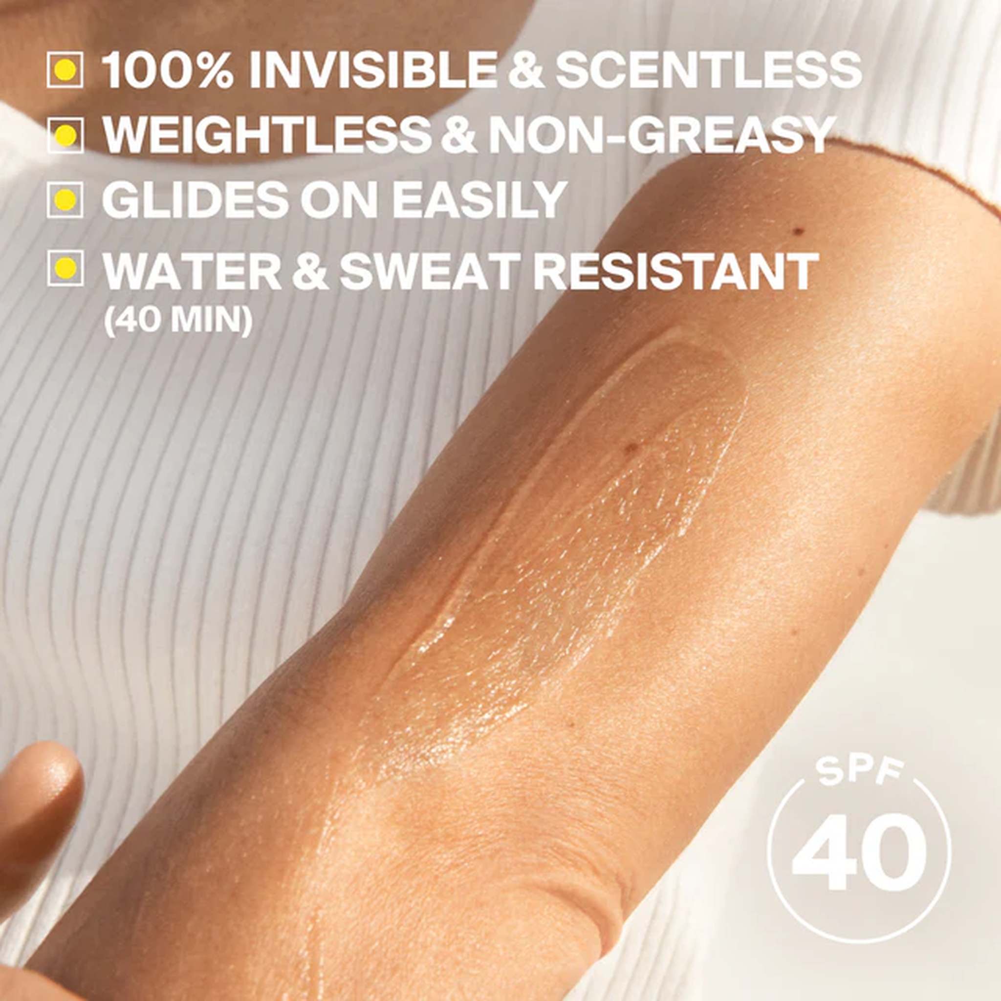 Sunscreen swatch on arm showing invisible scentless weightless and water resistant formula