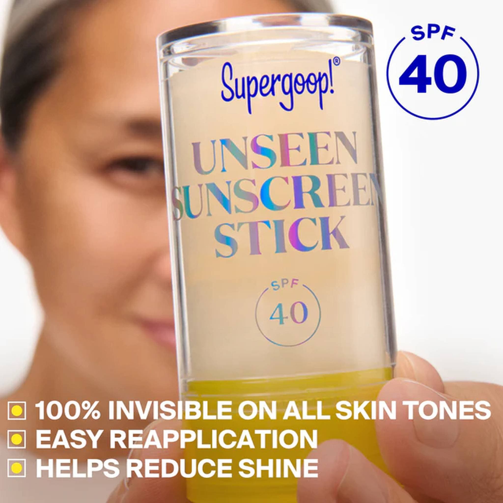 Woman holding Unseen Sunscreen Stick SPF 40 that's invisible on all skin tones and reduces shine