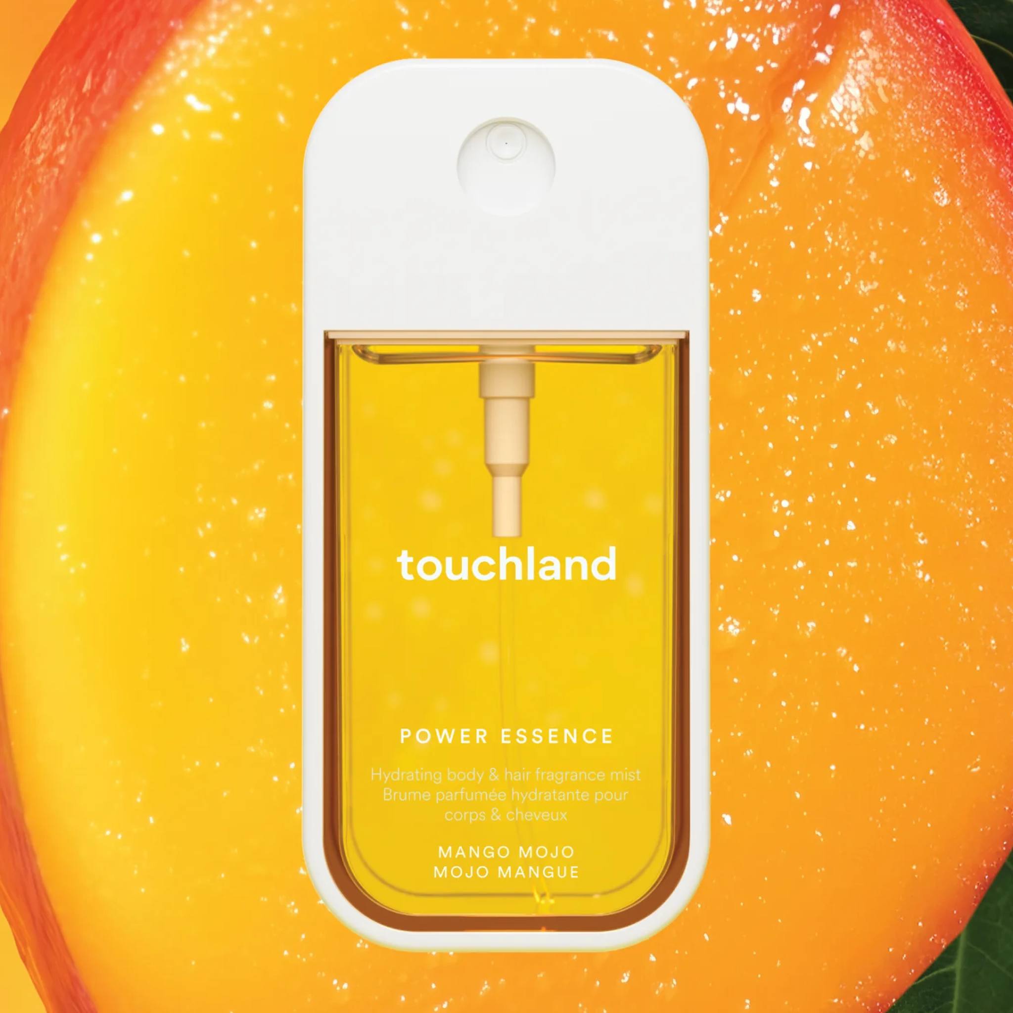 Touchland Power Essence Mango Mojo fragrance mist on a juicy ripe mango