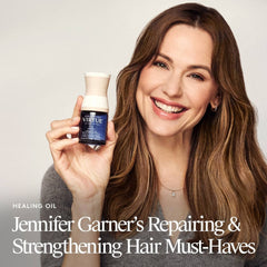 Jennifer Garner holding VIRTUE Healing Oil for repairing and strengthening hair