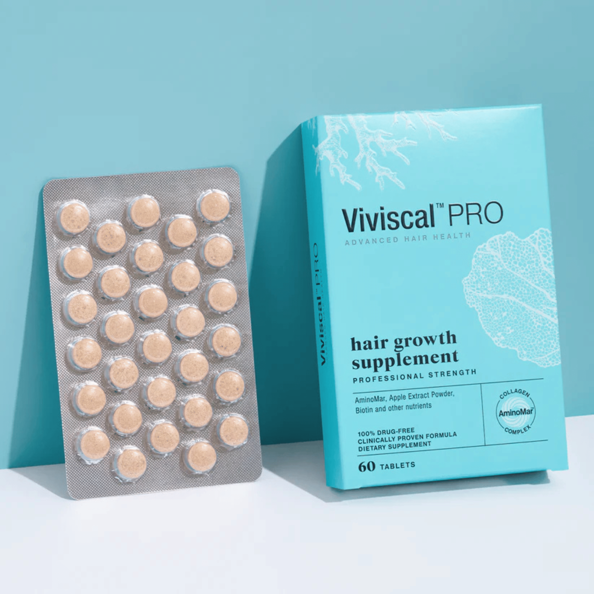Viviscal Pro hair growth supplement packaging with tablets on a light blue background