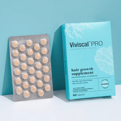 Viviscal Pro hair growth supplement packaging with tablets on a light blue background